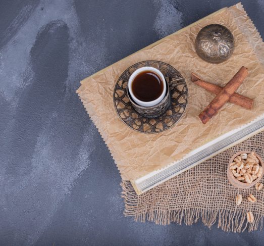 Cup of tea, cinnamon on dark background Cup of tea, cinnamon on dark background . High quality photo